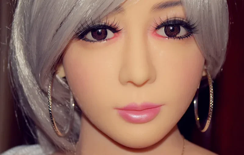 Lifelike doll with silver hair and earrings