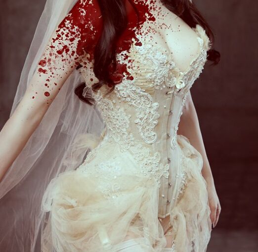 Blood-splattered bride in lace wedding corset