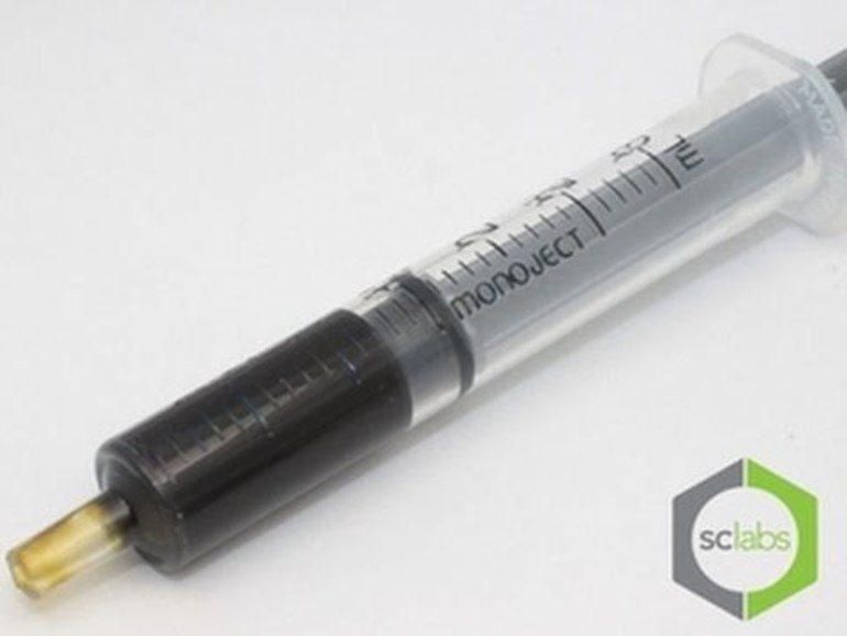 Syringe with black fluid and SC Labs logo