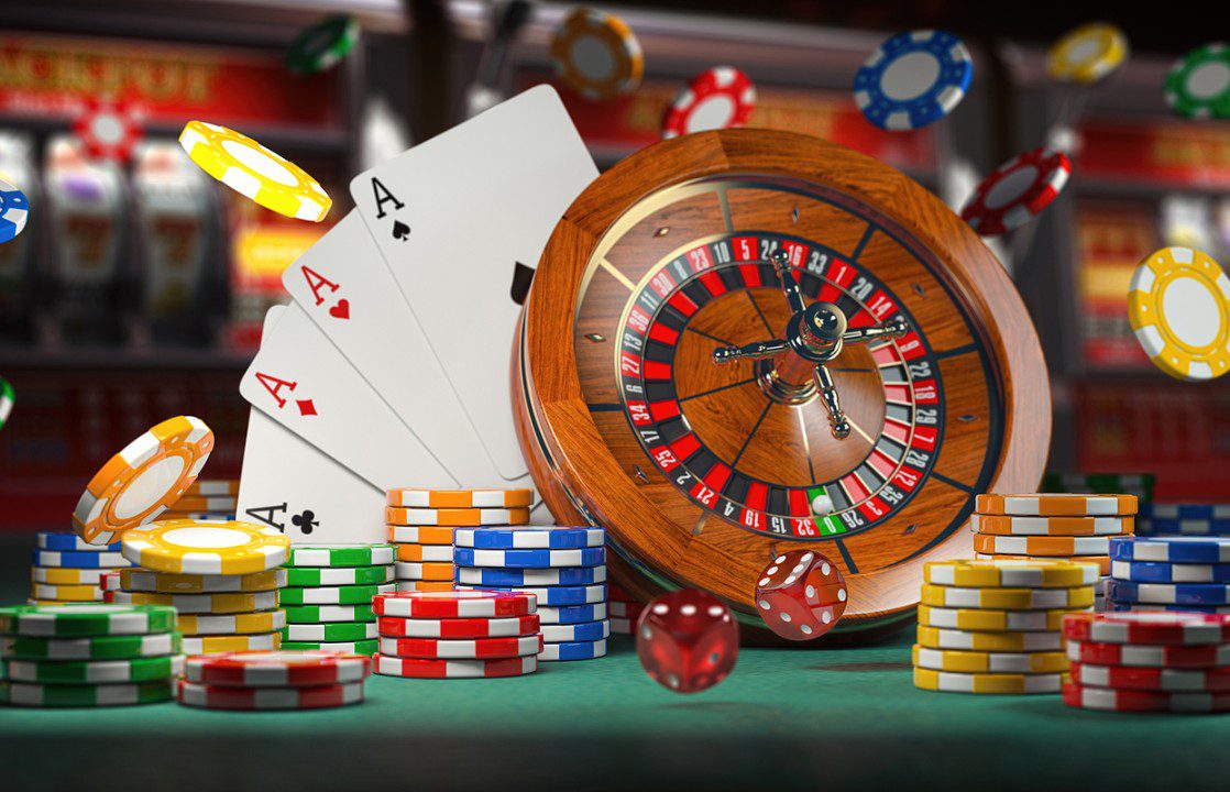 Casino roulette, poker chips, and four aces