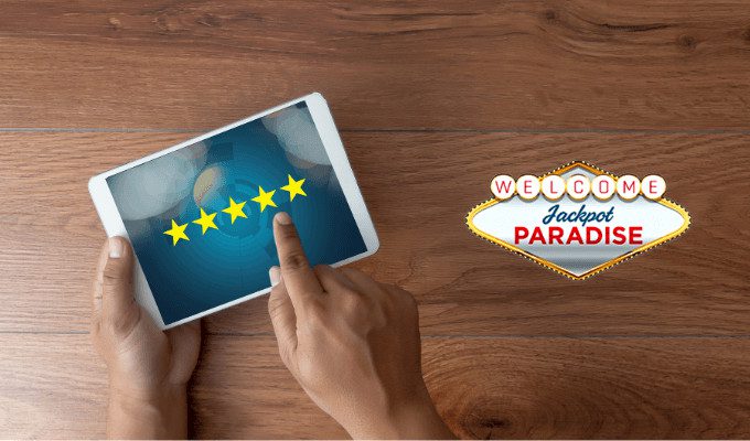 Hands giving five-star rating on tablet