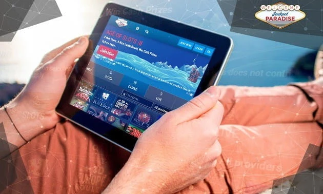Person holding tablet showing online casino games